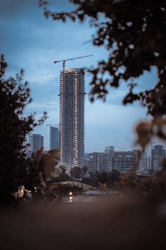 high rise tall building under blue sky during daytime town